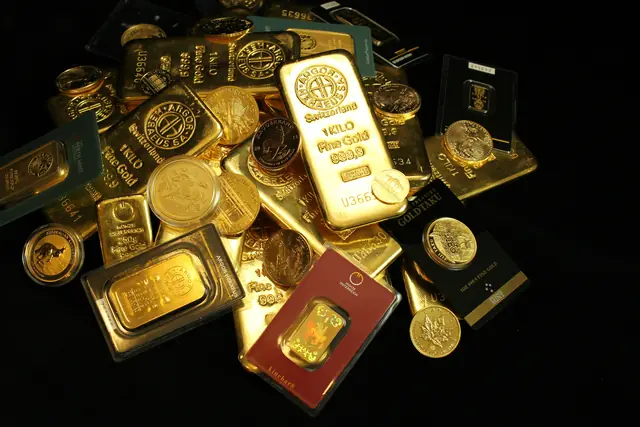 Konvolut aus Goldbarren und Münzen